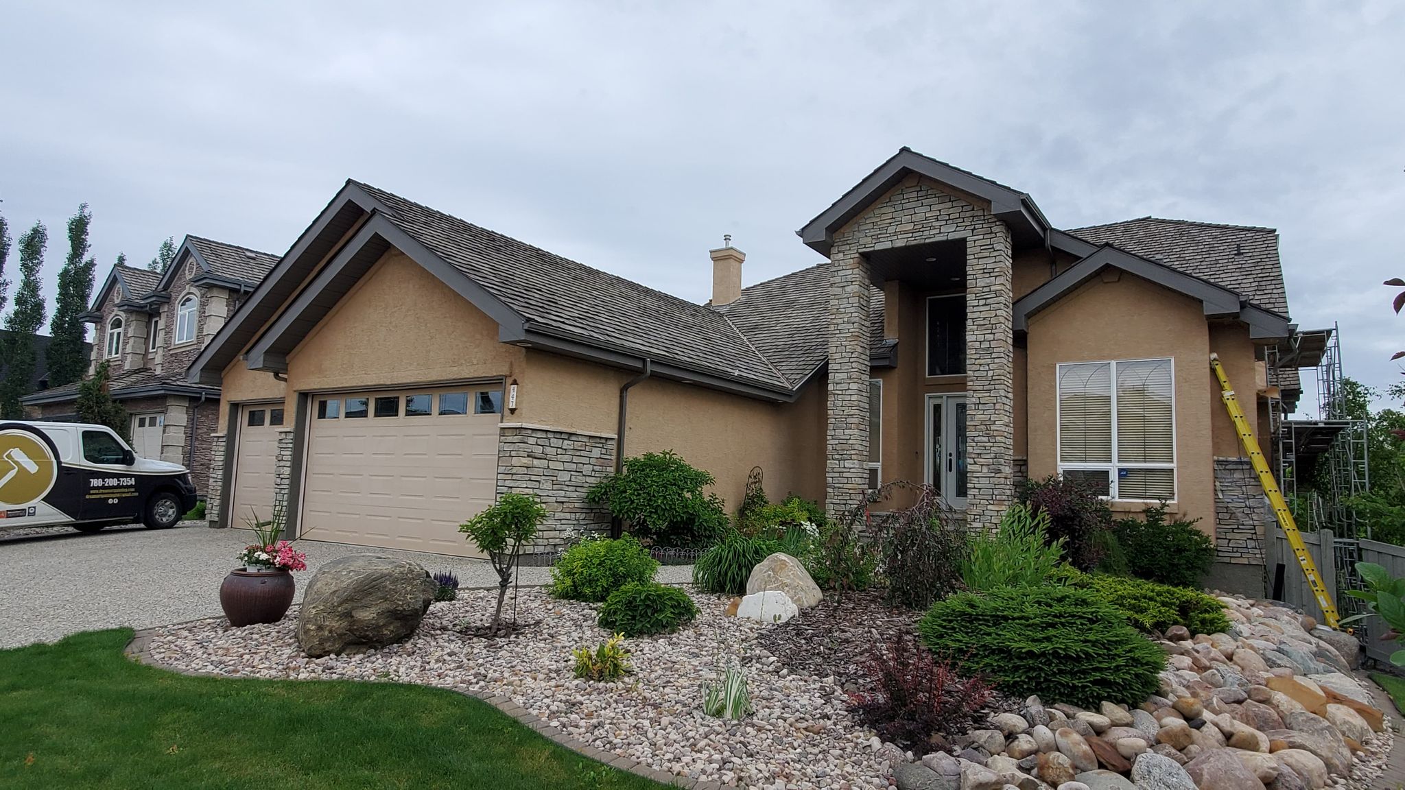 House exterior before professional painting - Edmonton